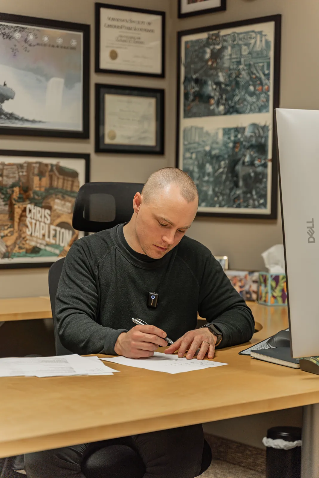 Trent Romens at his desk